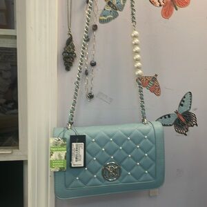Soft blue quilted purse with Jumbo pearls and the adjustable Crossbody strap